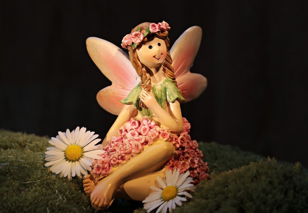 A model of an elf with some daisies