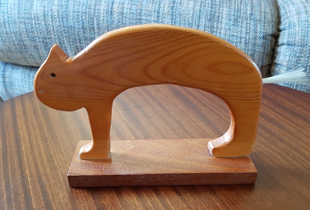 a carved wooden cat